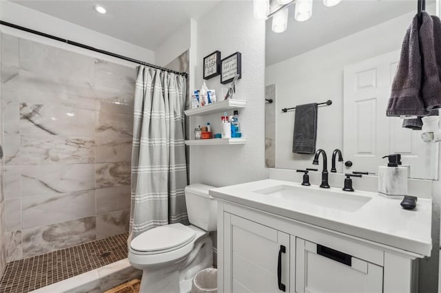 bathroom with toilet, vanity, and a shower with shower curtain