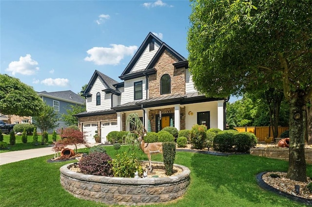 craftsman inspired home featuring a garage and a front yard