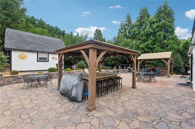 exterior space with a gazebo and a bar