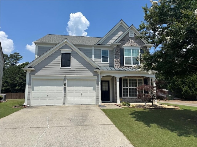 8965 Friarbridge Dr, Suwanee, GA 30024 - view of front of home with driveway, an attached garage, a standing seam roof, and stone siding