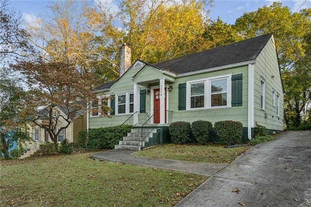 bungalow with a front yard