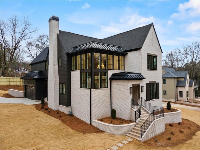 56 Pine St, Roswell, GA 30075 - view of front of home featuring brick siding, a chimney, and roof with shingles