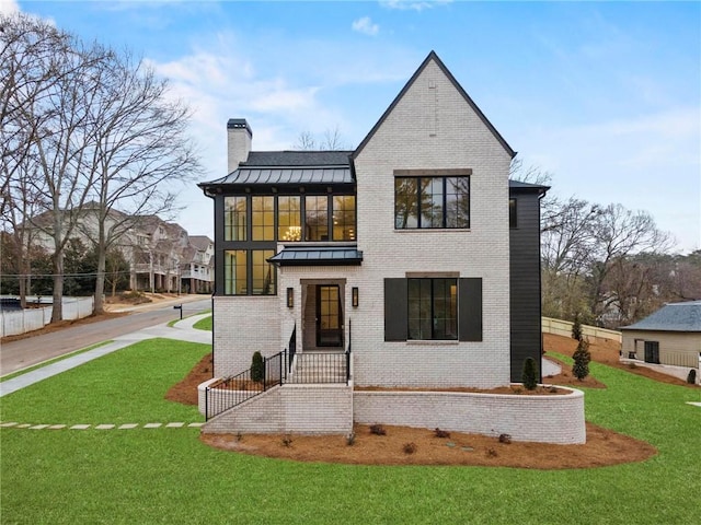 56 Pine St, Roswell, GA 30075 - back of house with a chimney, a standing seam roof, brick siding, and a metal roof