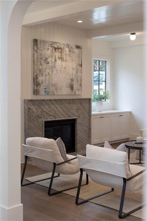56 Pine St, Roswell, GA 30075 - sitting room with wood finished floors, a premium fireplace, and arched walkways