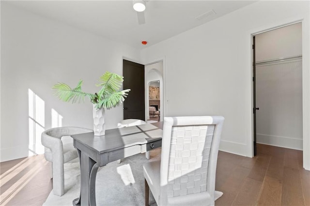 56 Pine St, Roswell, GA 30075 - dining area with arched walkways, wood finished floors, a ceiling fan, and baseboards