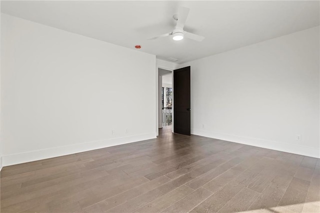 56 Pine St, Roswell, GA 30075 - spare room with wood finished floors, baseboards, and ceiling fan