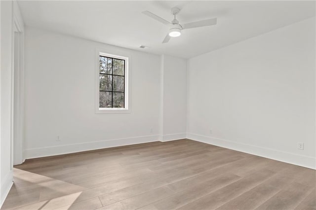 56 Pine St, Roswell, GA 30075 - unfurnished room with wood finished floors, baseboards, and ceiling fan