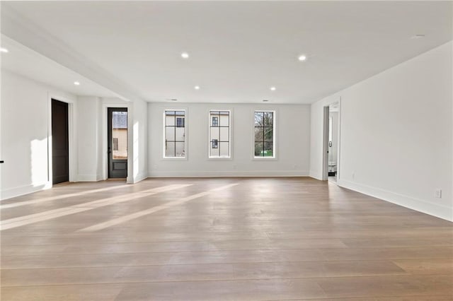 56 Pine St, Roswell, GA 30075 - unfurnished living room with light wood-style flooring, baseboards, and recessed lighting