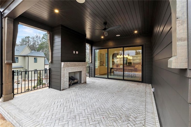 56 Pine St, Roswell, GA 30075 - view of patio / terrace with an outdoor brick fireplace and a ceiling fan