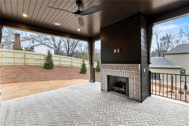 56 Pine St, Roswell, GA 30075 - view of patio / terrace featuring an outdoor brick fireplace, a fenced backyard, and ceiling fan