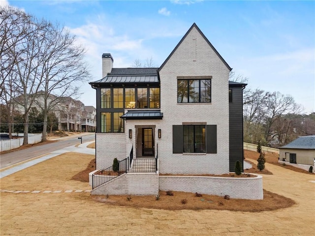 56 Pine St, Roswell, GA 30075 - view of front of property featuring a chimney, a standing seam roof, and brick siding