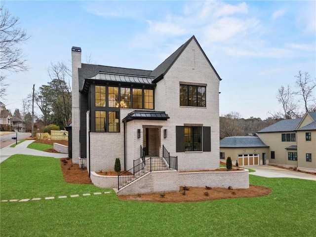56 Pine St, Roswell, GA 30075 - view of front facade with a standing seam roof, brick siding, a chimney, driveway, and a front lawn