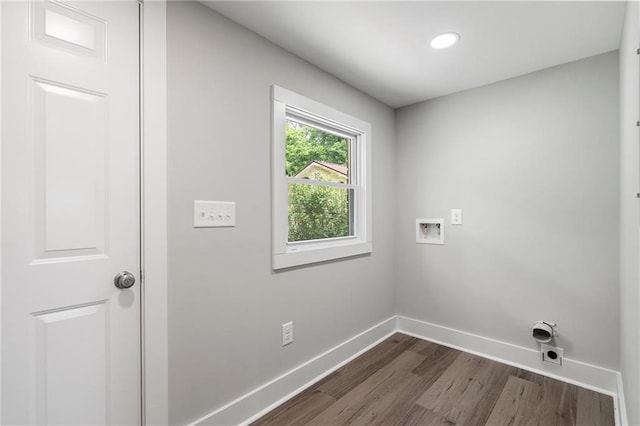 washroom featuring hookup for an electric dryer, laundry area, hookup for a washing machine, baseboards, and dark wood finished floors