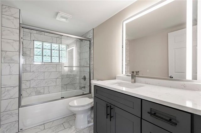bathroom featuring bath / shower combo with glass door, toilet, vanity, and marble finish floor