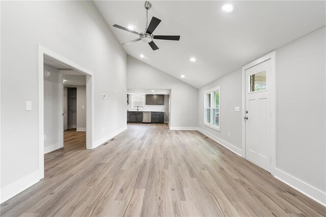 unfurnished living room with baseboards, recessed lighting, ceiling fan, and light wood-style flooring