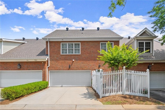 8730 Parker Pl, Roswell, GA 30076 - view of front of house with brick siding, a shingled roof, concrete driveway, and an attached garage