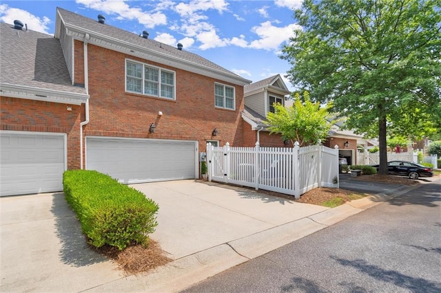 8730 Parker Pl, Roswell, GA 30076 - view of front of property with brick siding, a garage, concrete driveway, and a shingled roof