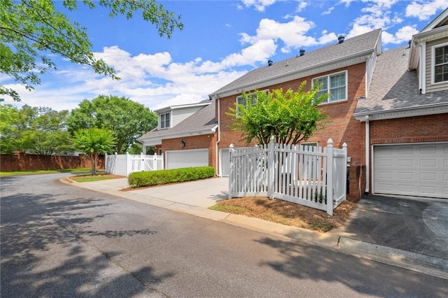 8730 Parker Pl, Roswell, GA 30076 - view of front of home featuring driveway, brick siding, and roof with shingles