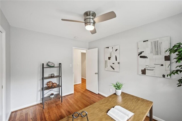 1118 Creekdale Dr, Clarkston, GA 30021 - home office with baseboards, wood finished floors, and a ceiling fan