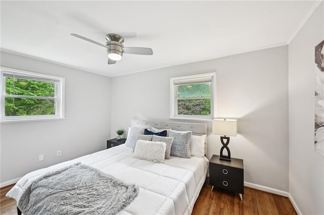 1118 Creekdale Dr, Clarkston, GA 30021 - bedroom with wood finished floors, baseboards, and ceiling fan