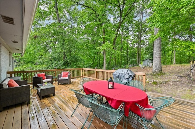 1118 Creekdale Dr, Clarkston, GA 30021 - wooden terrace with outdoor lounge area, outdoor dining area, and view of wooded area