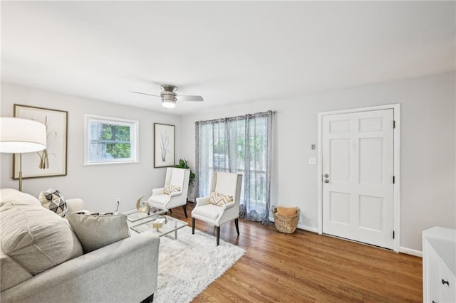 1118 Creekdale Dr, Clarkston, GA 30021 - living area with ceiling fan, light wood finished floors, and baseboards