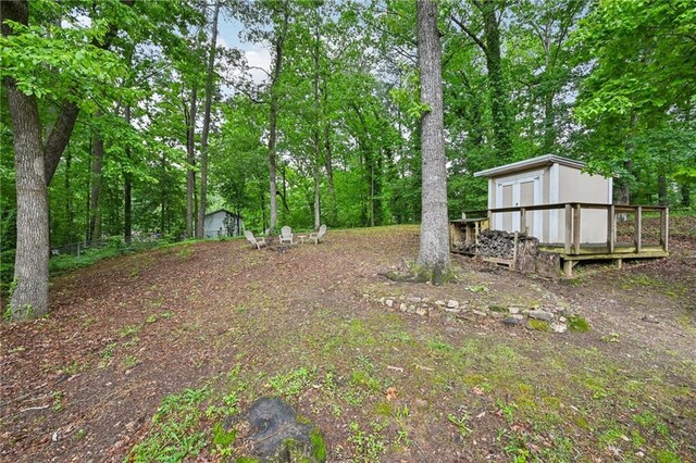 1118 Creekdale Dr, Clarkston, GA 30021 - view of yard featuring a storage shed, an outdoor structure, and a garage