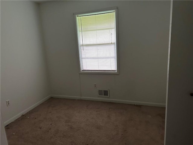 unfurnished room with light colored carpet