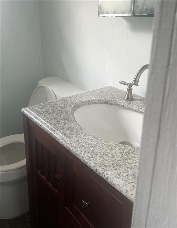 bathroom with vanity and toilet