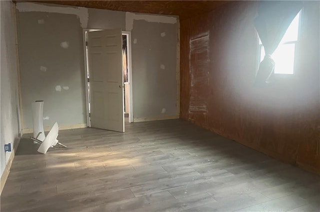 unfurnished room featuring light hardwood / wood-style floors