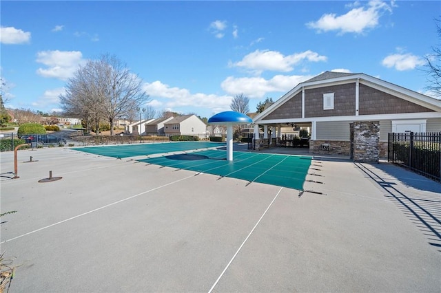 community pool with fence and a patio area