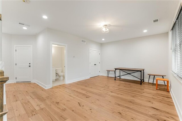 unfurnished room with light wood-type flooring