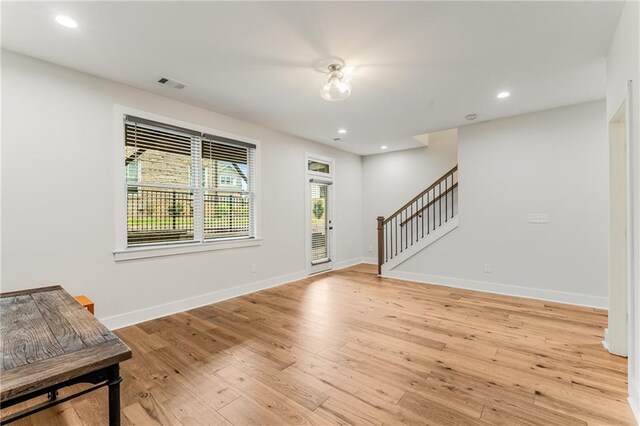 foyer entrance with light hardwood / wood-style flooring