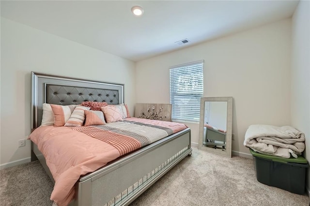 bedroom with light colored carpet