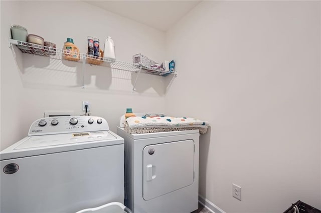 clothes washing area with independent washer and dryer