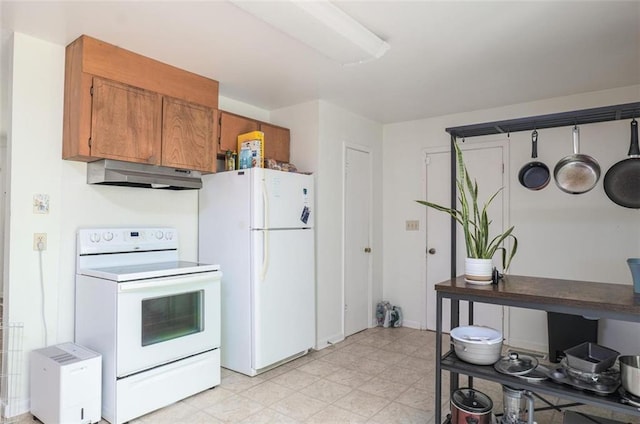 kitchen featuring light floors, white appliances, brown cabinetry, and under cabinet range hood