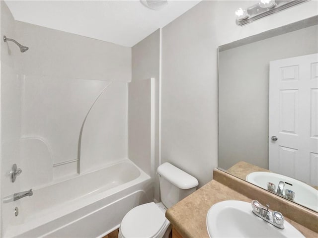 full bathroom with vanity, tub / shower combination, and toilet