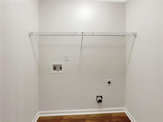 clothes washing area with hookup for an electric dryer, laundry area, wood finished floors, and hookup for a washing machine