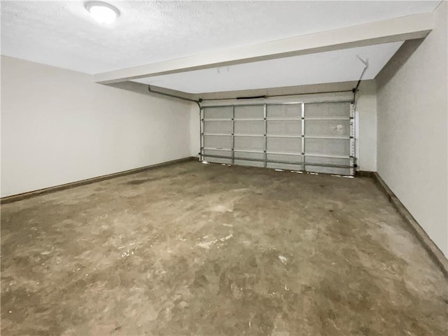 garage featuring baseboards