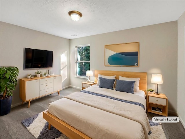 bedroom with baseboards, carpet, and visible vents