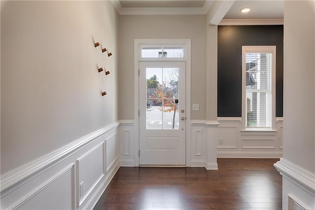 entryway with crown molding and dark hardwood / wood-style flooring