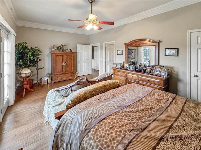 bedroom featuring crown molding, multiple windows, a ceiling fan, and light wood finished floors