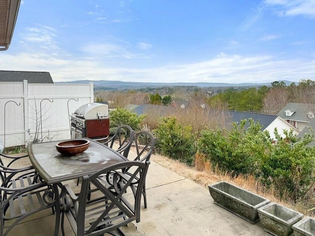 view of patio featuring outdoor dining area and a grill