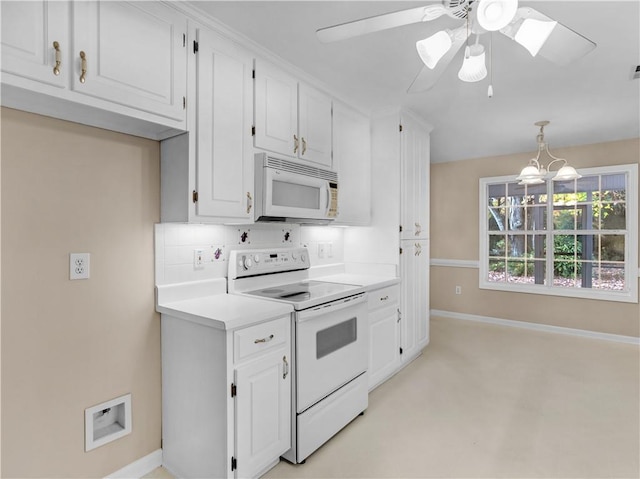 kitchen featuring pendant lighting, light countertops, decorative backsplash, white cabinets, and white appliances