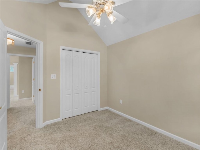 unfurnished bedroom with light carpet, visible vents, baseboards, and a closet