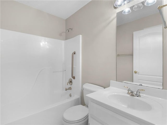 bathroom with bathtub / shower combination, vanity, and toilet