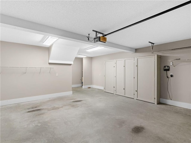 garage featuring baseboards and a garage door opener