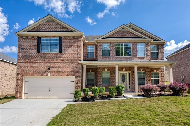 craftsman inspired home featuring brick siding, a porch, concrete driveway, a front yard, and a garage