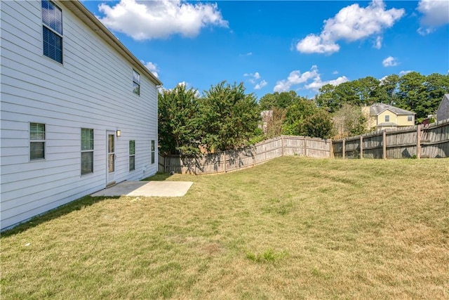 view of yard with a patio and a fenced backyard