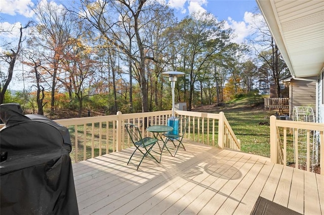 wooden terrace featuring area for grilling